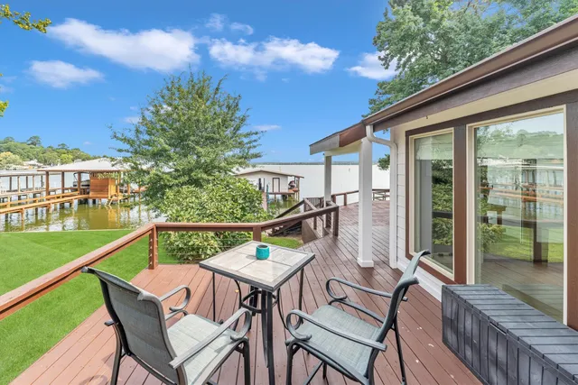 a view of a chairs and table in the balcony