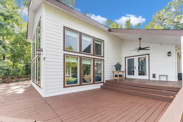 a view of a patio with table and chairs and potted plants