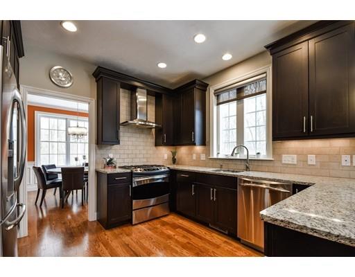 7 Willow Road Ashland, MA 01721 - Photo 4 of 32 a kitchen with stainless steel appliances granite countertop sink stove and granite counter top