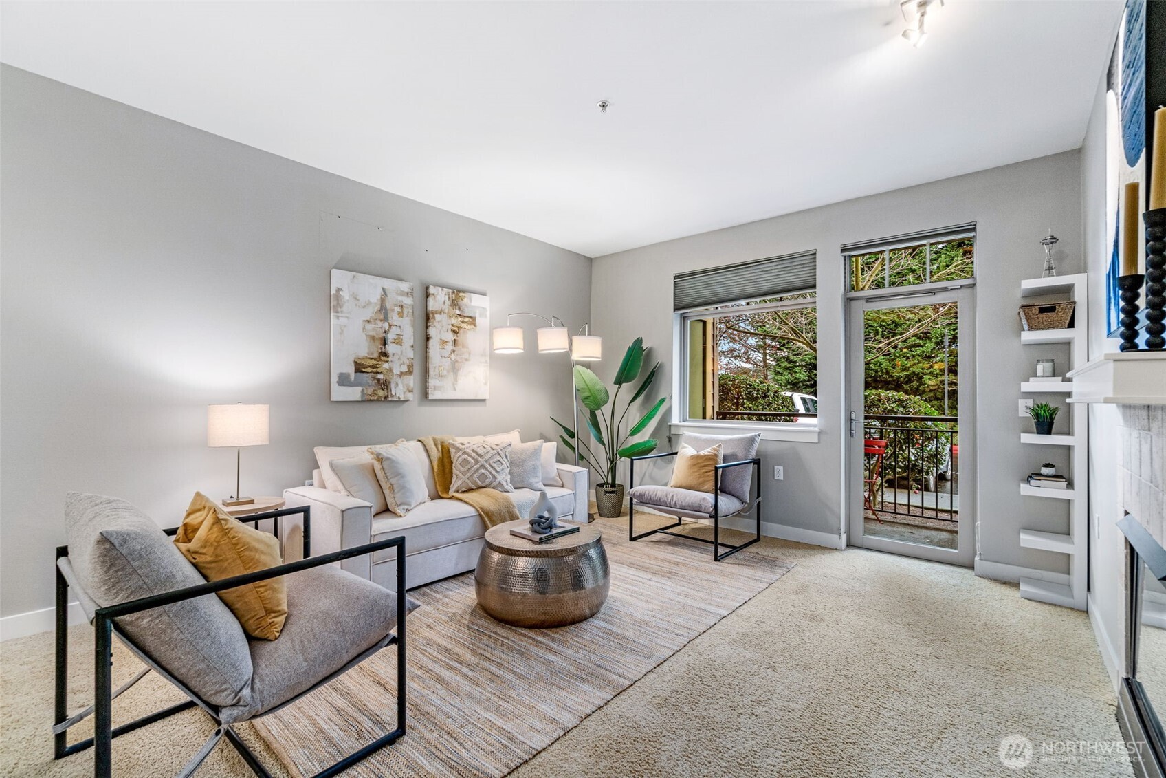 15700 116th Avenue Northeast, Unit 102A Bothell, WA 98011 - Photo 2 of 35 a living room with furniture and a potted plant