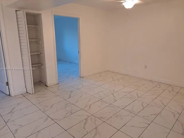 an empty room with white walls