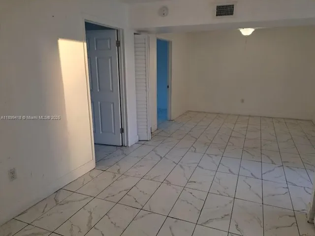 an empty room with natural light