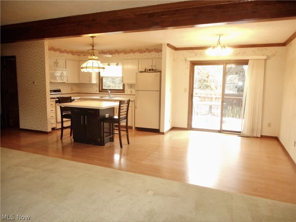 2532 Graham Road Stow, OH 44224 - Photo 24 of 24 Open floor plan. This is a view from the Living Room to the Kitchen and Dining Room with Sliders to the back deck.