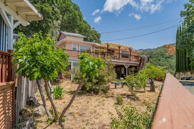 an outdoor view of a house with swimming pool