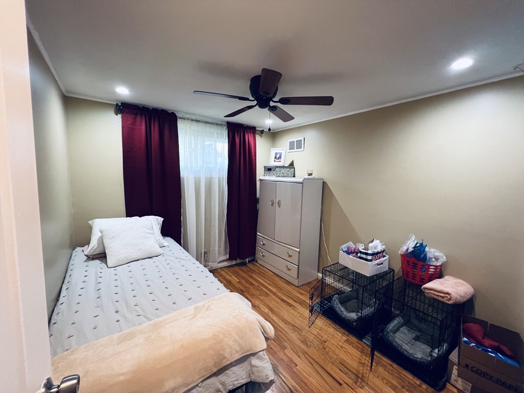 18 Shirley Road Springfield, MA 01109 - Photo 12 of 39 a bedroom with furniture and wooden floor