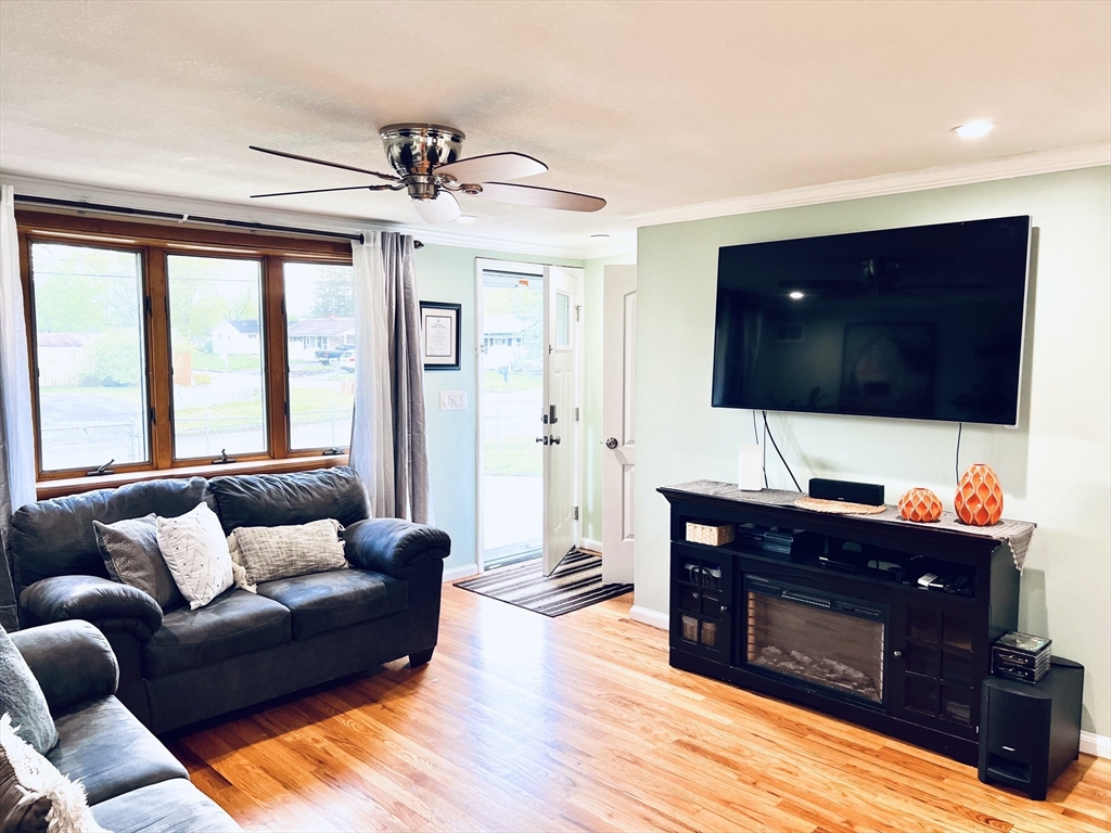 18 Shirley Road Springfield, MA 01109 - Photo 2 of 39 a living room with furniture and a flat screen tv