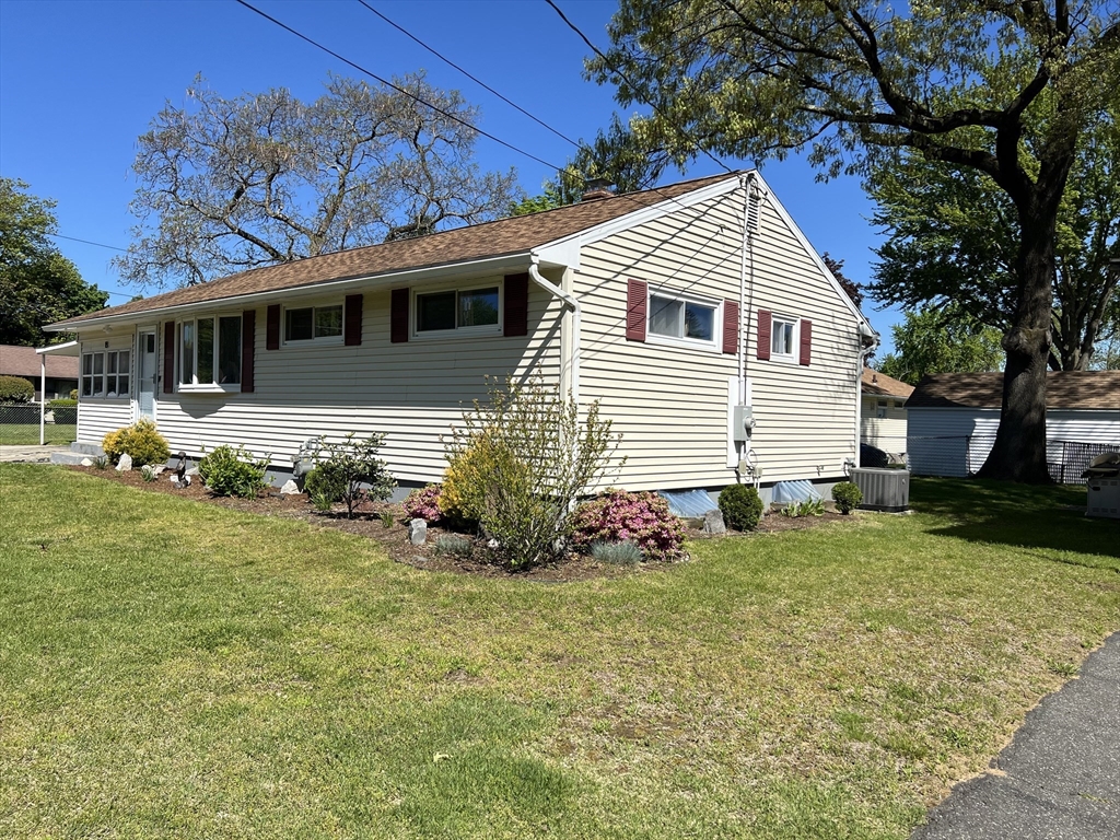 18 Shirley Road Springfield, MA 01109 - Photo 38 of 39 a front view of a house with a garden