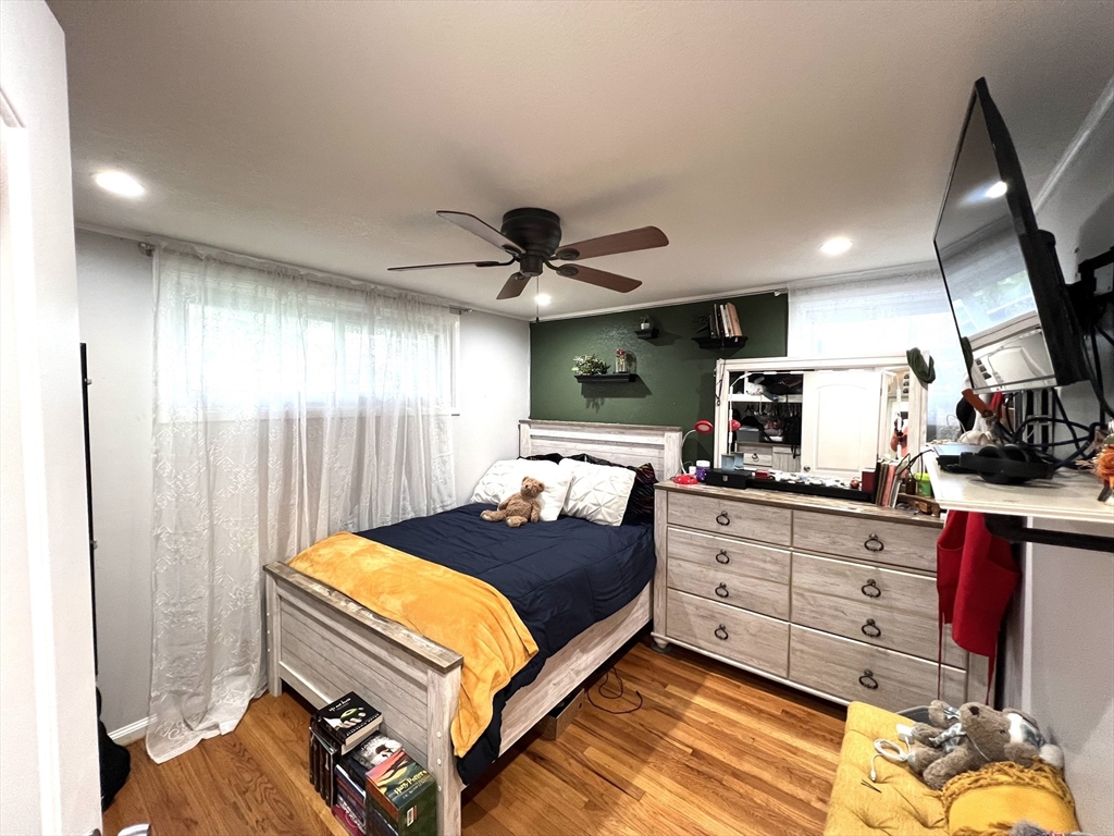 18 Shirley Road Springfield, MA 01109 - Photo 8 of 39 a bedroom with a bed and a chandelier