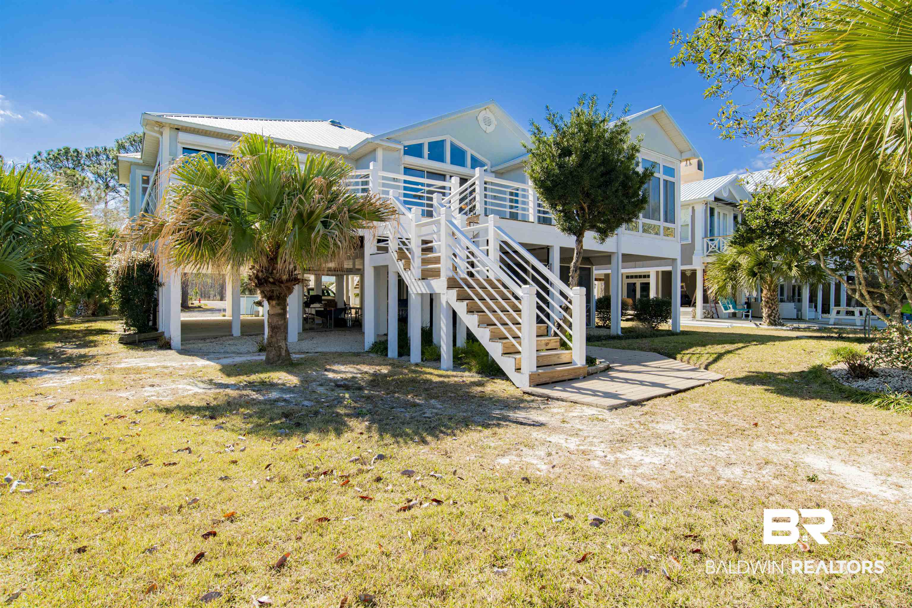 24615 Gulf Bay Road Orange Beach, AL 36561 - Photo 36 of 47 MATURE LANDSCAPING, CARPORT PARKING UNDER HOME