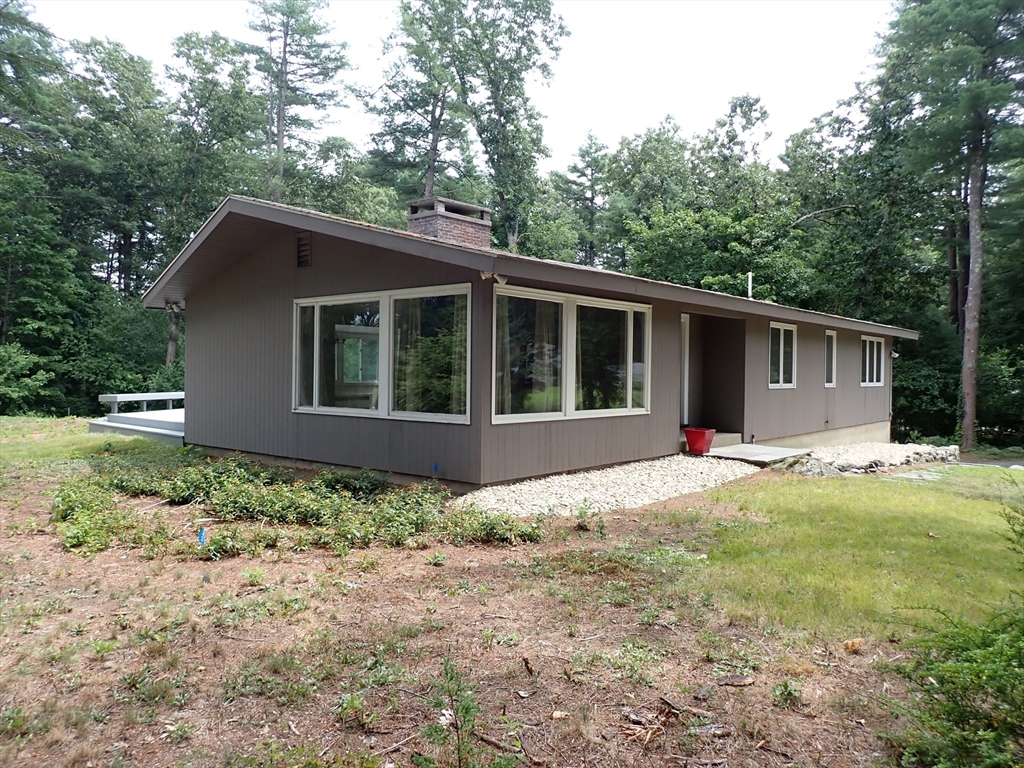 a view of house with backyard and outdoor space