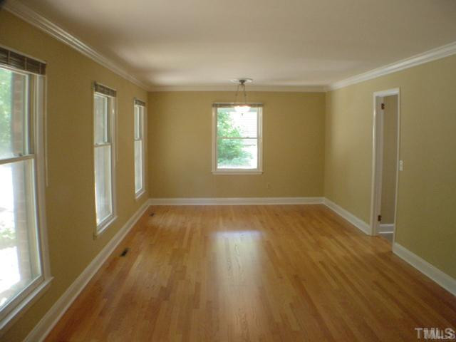 4404 Malvern Road Durham, NC 27707 - Photo 5 of 12 Dining Room: Hardwood floors with natural refinish...notice the crown molding...double thermal pane windows throughout the home. Dining Room