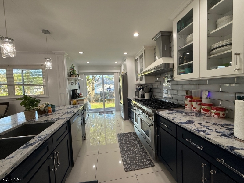 5 Appleman Road Somerset, NJ 08873 - Photo 11 of 12 a large kitchen with stainless steel appliances granite countertop a large stove a sink and a refrigerator