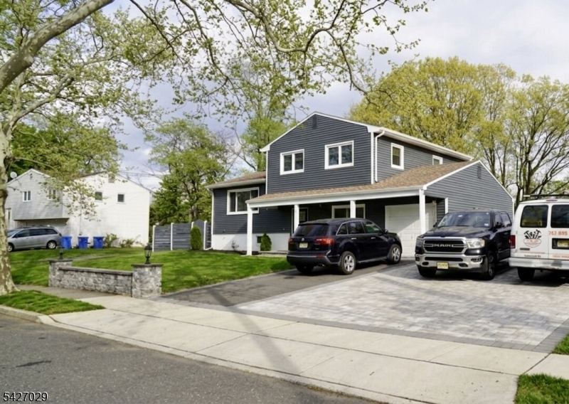 5 Appleman Road Somerset, NJ 08873 - Photo 2 of 12 a front view of a house with a garden