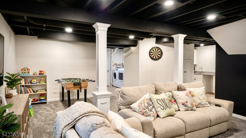 5 Appleman Road Somerset, NJ 08873 - Photo 6 of 12 a living room with furniture and a flat screen tv