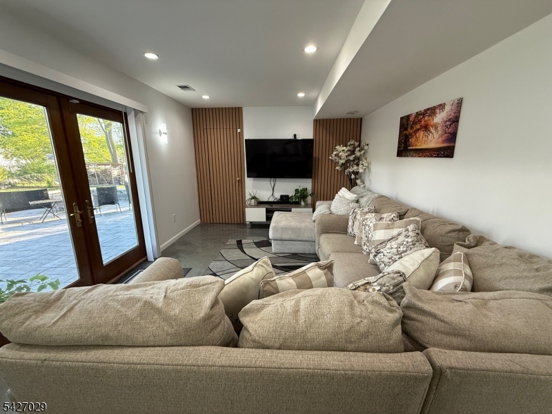 5 Appleman Road Somerset, NJ 08873 - Photo 8 of 12 a living room with furniture and a flat screen tv