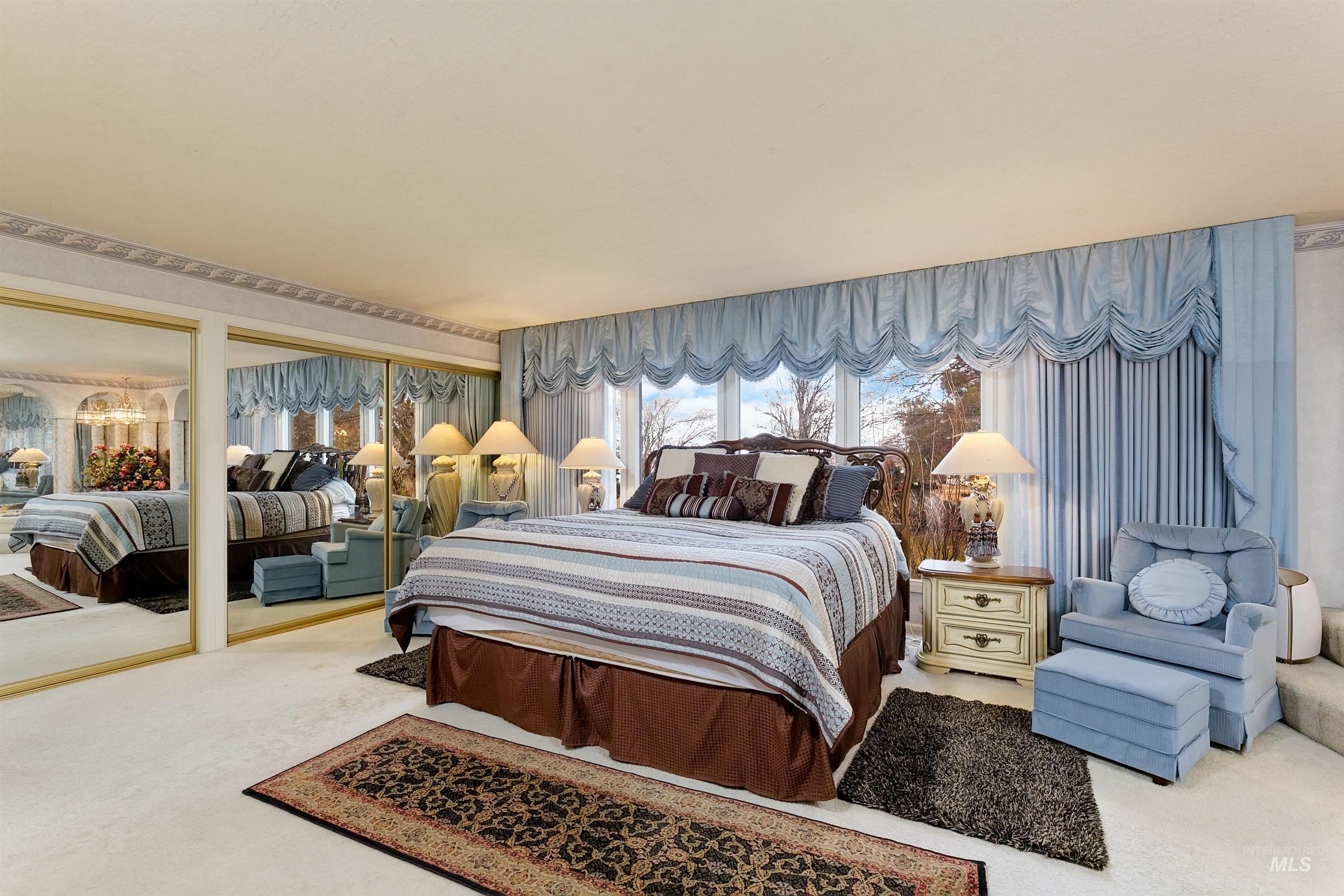 10030 West Stardust Drive Boise, ID 83709 - Photo 24 of 50 Carpeted bedroom featuring multiple closets