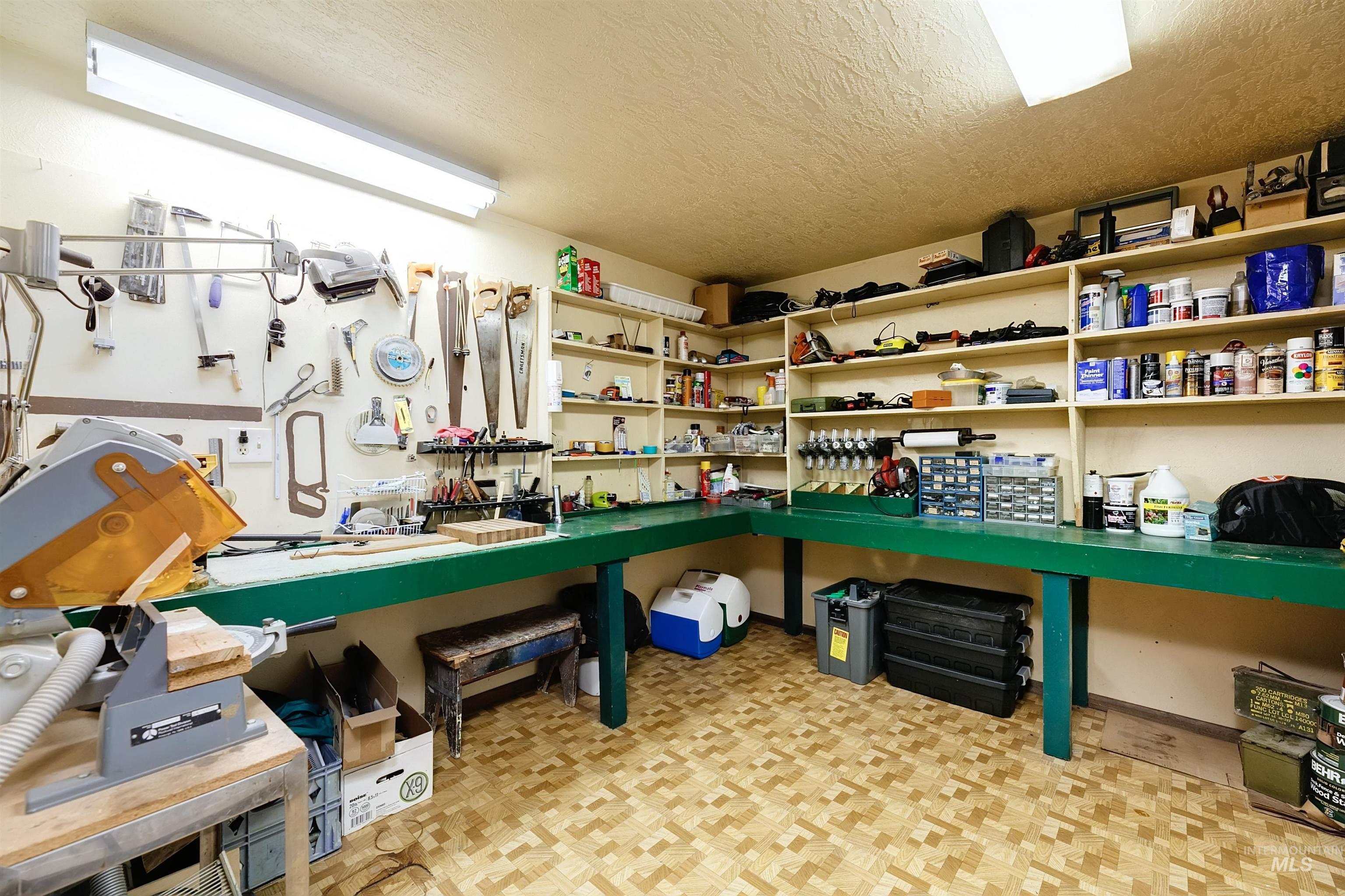 10030 West Stardust Drive Boise, ID 83709 - Photo 38 of 50 Miscellaneous room featuring a textured ceiling and parquet floors