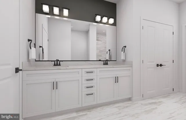 a bathroom with a double vanity sink and mirror