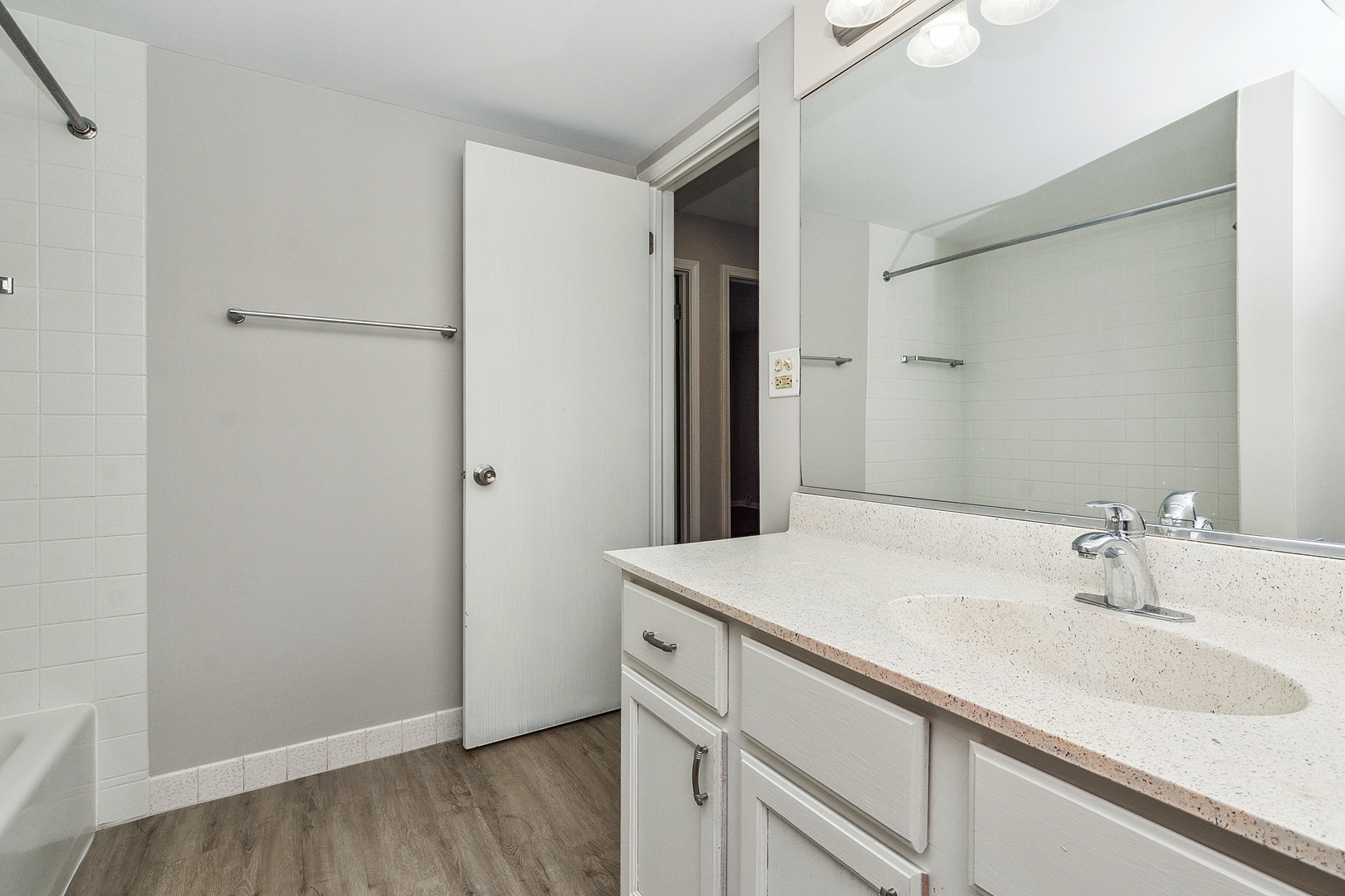 254 East Bailey Road, Unit M Naperville, IL 60565 - Photo 15 of 27 a bathroom with a sink and a mirror