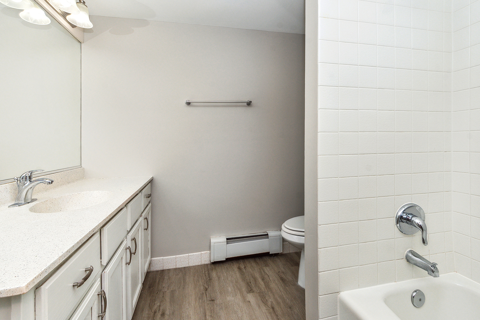 254 East Bailey Road, Unit M Naperville, IL 60565 - Photo 16 of 27 a bathroom with a sink a toilet and a bathtub