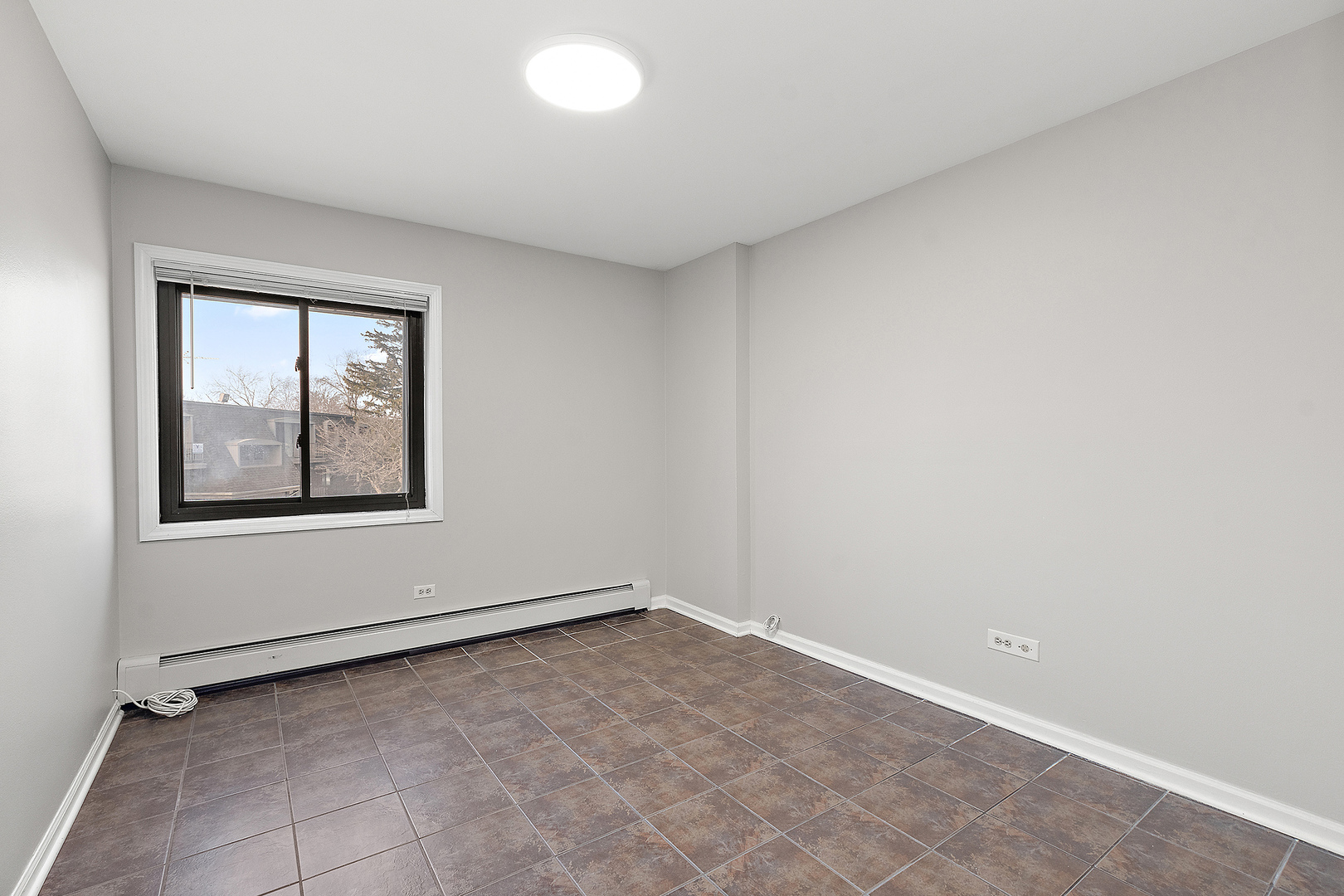 254 East Bailey Road, Unit M Naperville, IL 60565 - Photo 18 of 27 an empty room with a window