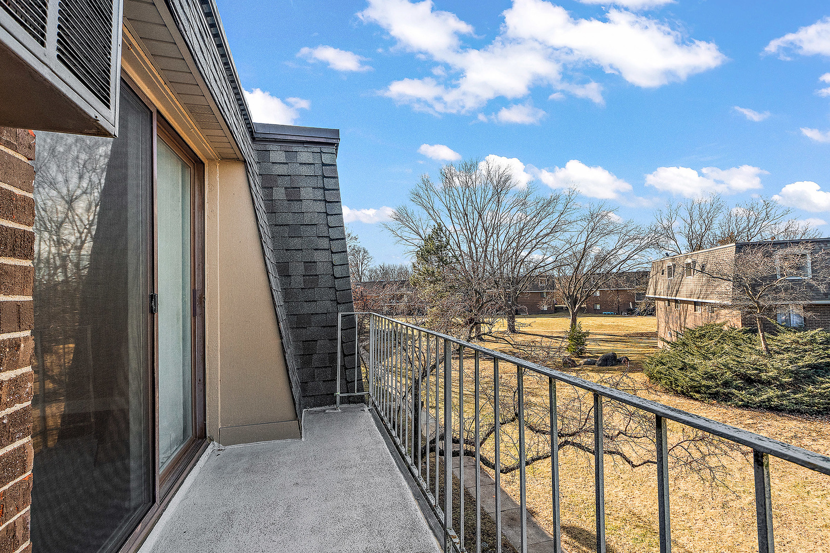 254 East Bailey Road, Unit M Naperville, IL 60565 - Photo 21 of 27 a view of balcony with wooden floor and fence