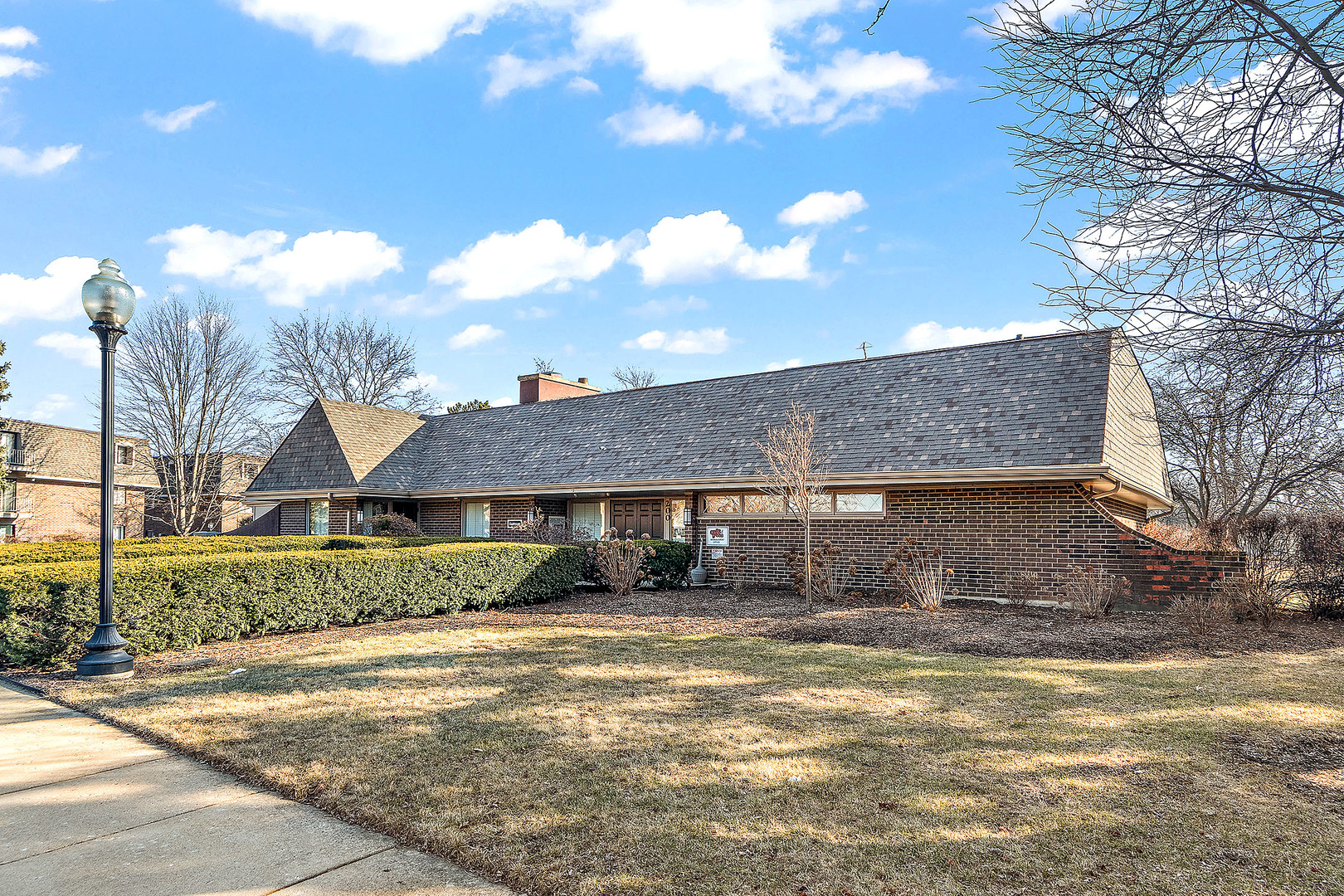 254 East Bailey Road, Unit M Naperville, IL 60565 - Photo 23 of 27 a front view of a house with a yard and garage