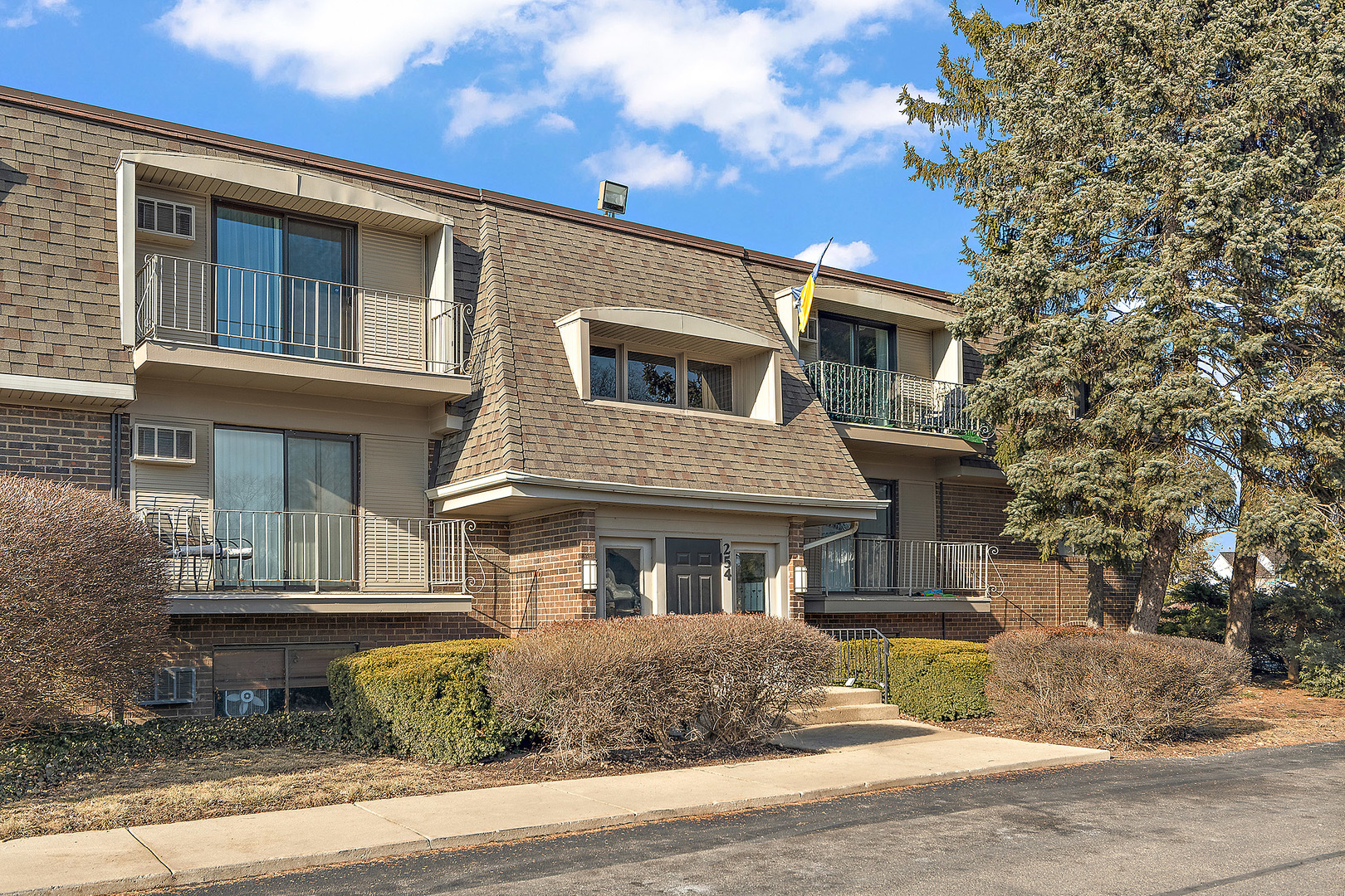 254 East Bailey Road, Unit M Naperville, IL 60565 - Photo 27 of 27 a front view of a house with a yard