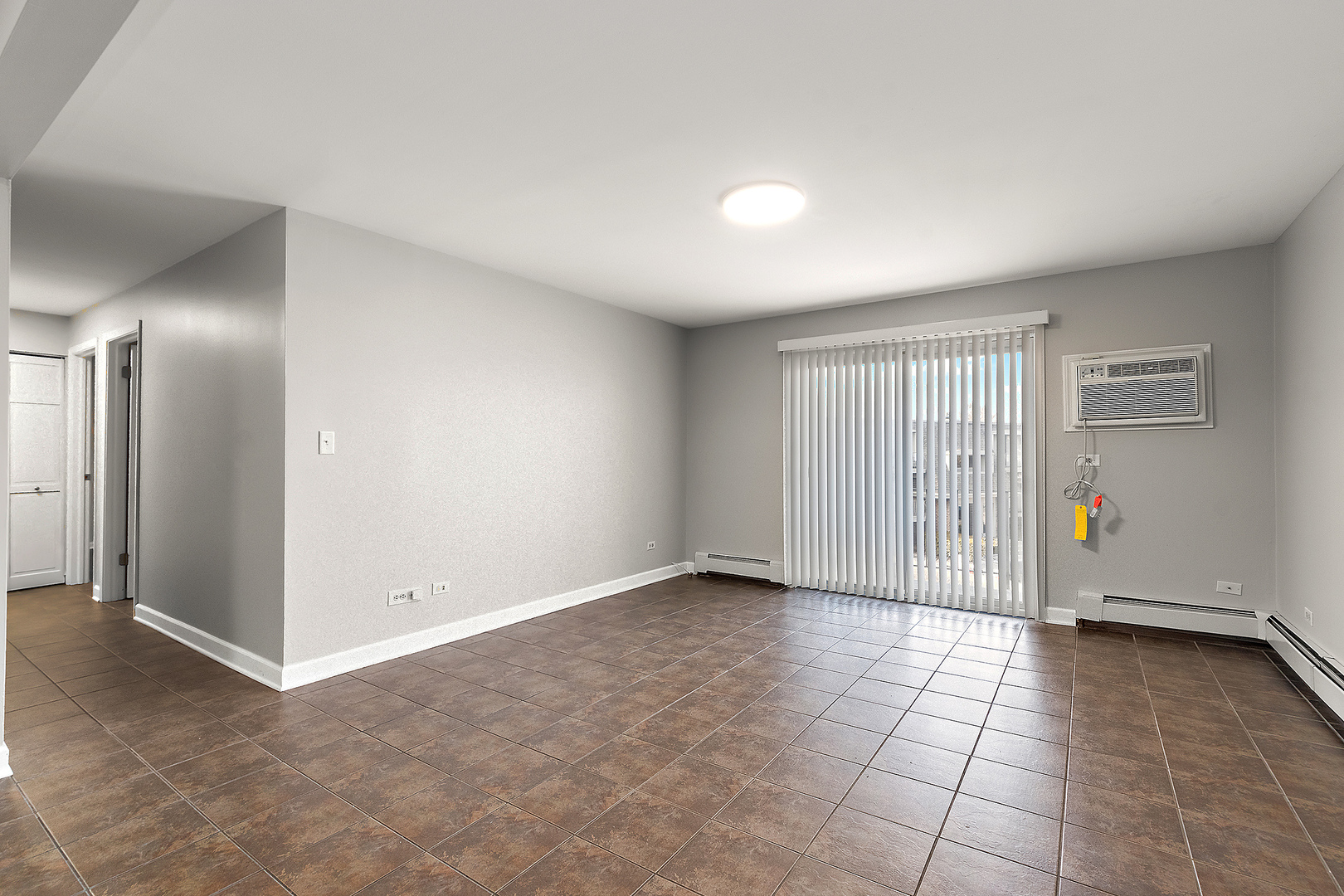 254 East Bailey Road, Unit M Naperville, IL 60565 - Photo 5 of 27 wooden floor in an empty room with a window