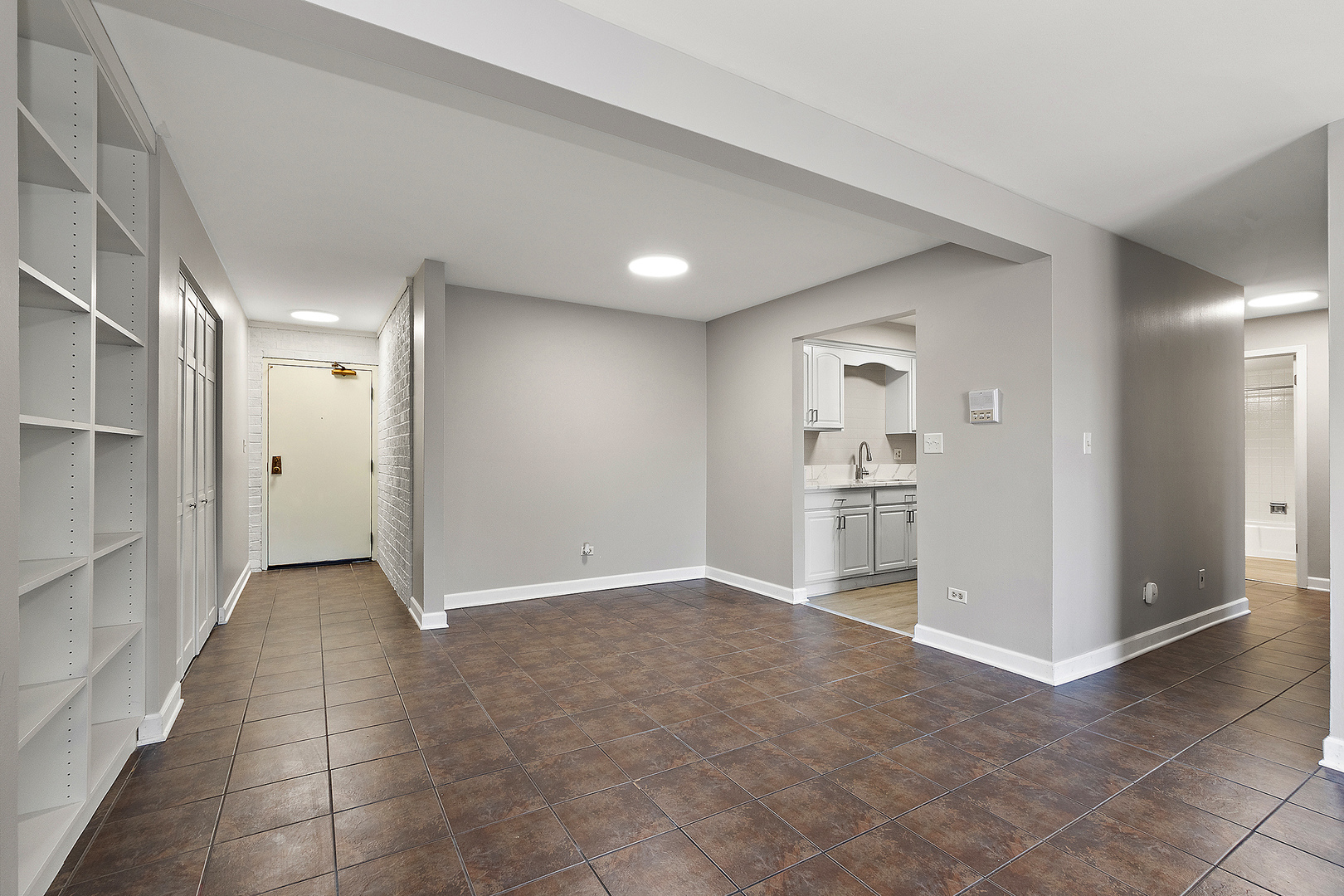 254 East Bailey Road, Unit M Naperville, IL 60565 - Photo 8 of 27 a view of a hallway with wooden shelves