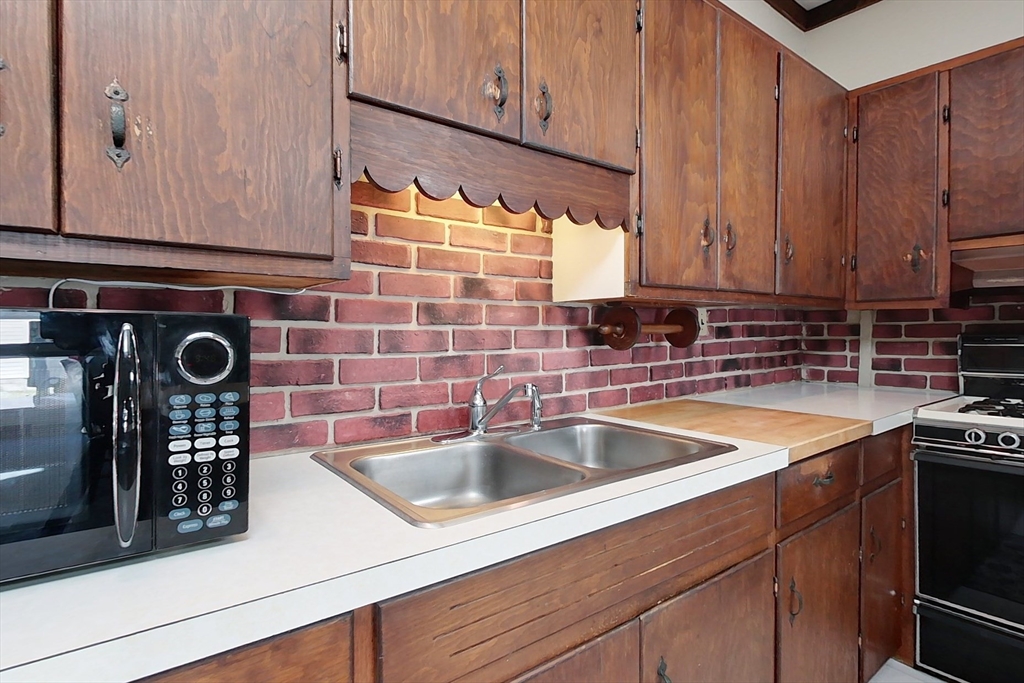 116 Shelters Road Groton, MA 01450 - Photo 3 of 41 a kitchen with stainless steel appliances granite countertop a sink and a white cabinets