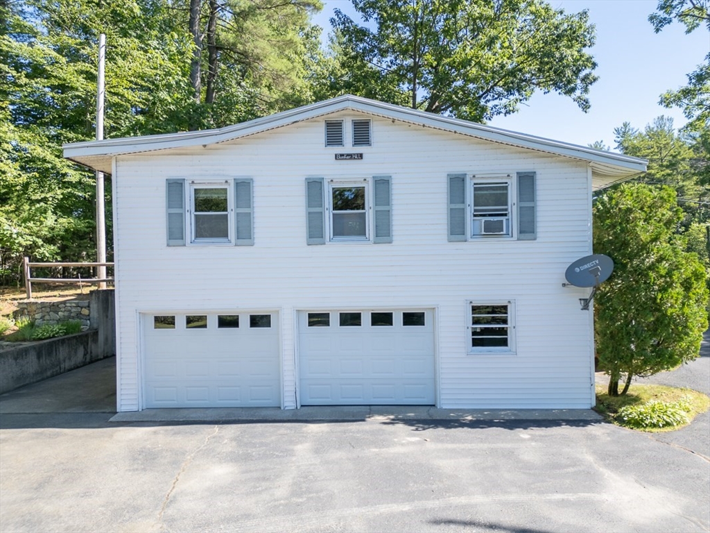 116 Shelters Road Groton, MA 01450 - Photo 31 of 41 a front view of a house with a yard