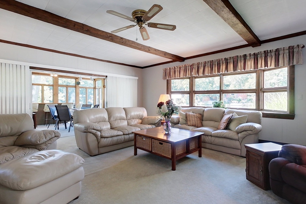 116 Shelters Road Groton, MA 01450 - Photo 8 of 41 a living room with furniture and a large window