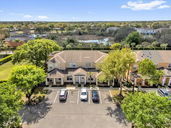 an aerial view of a houses with outdoor space