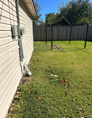 a view of a backyard with a swing
