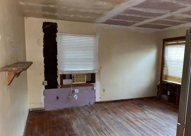 a view of workspace and bedroom with furniture