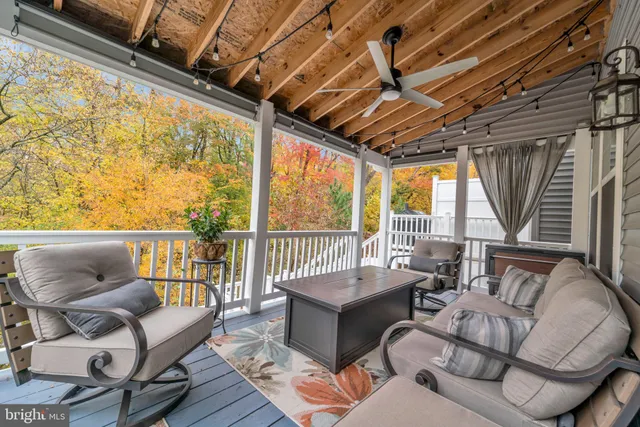 a bedroom with a large bed and a flat tv screen on dresser