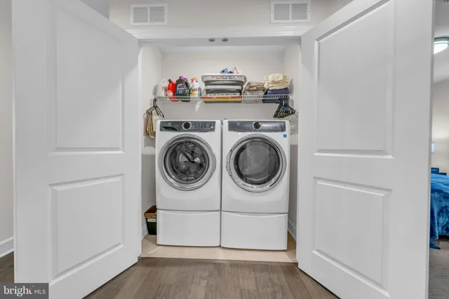 a view of an empty room and a window