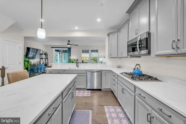 a bathroom with a sink toilet and a mirror