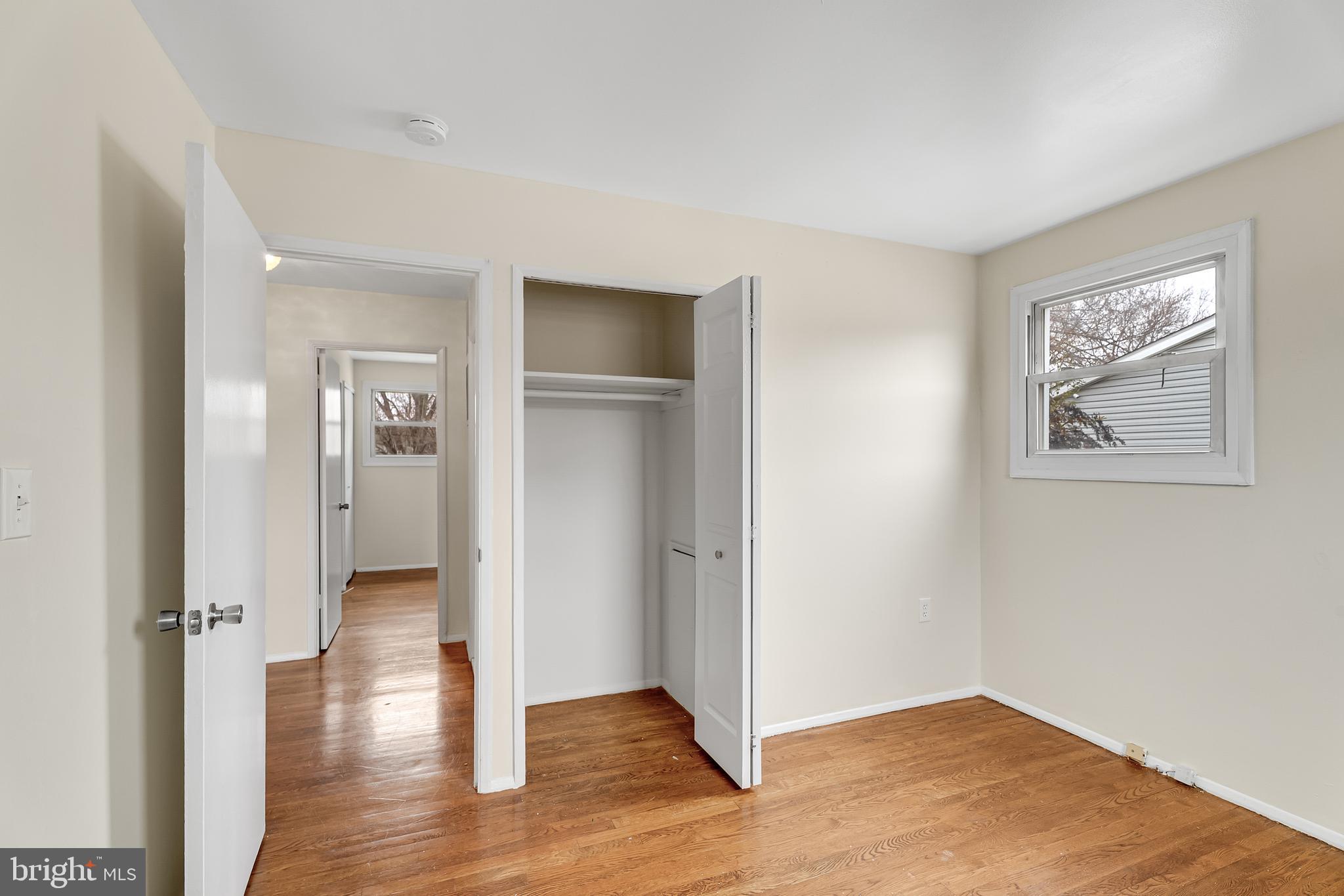 264 Old Line Avenue Laurel, MD 20724 - Photo 15 of 31 an empty room with wooden floor and a window