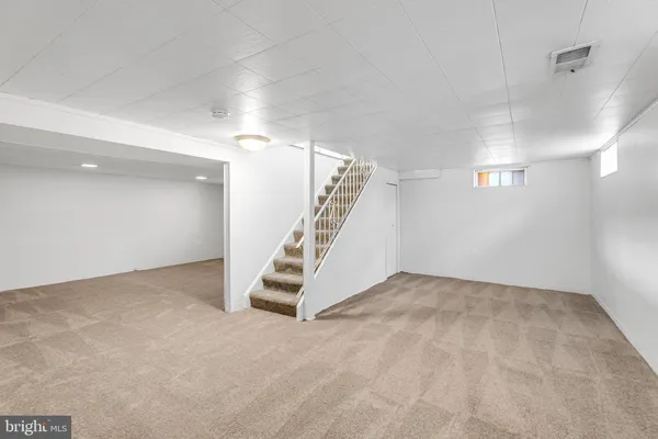 a view of an empty room with stairs