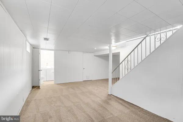 a view of room with stairs and a window