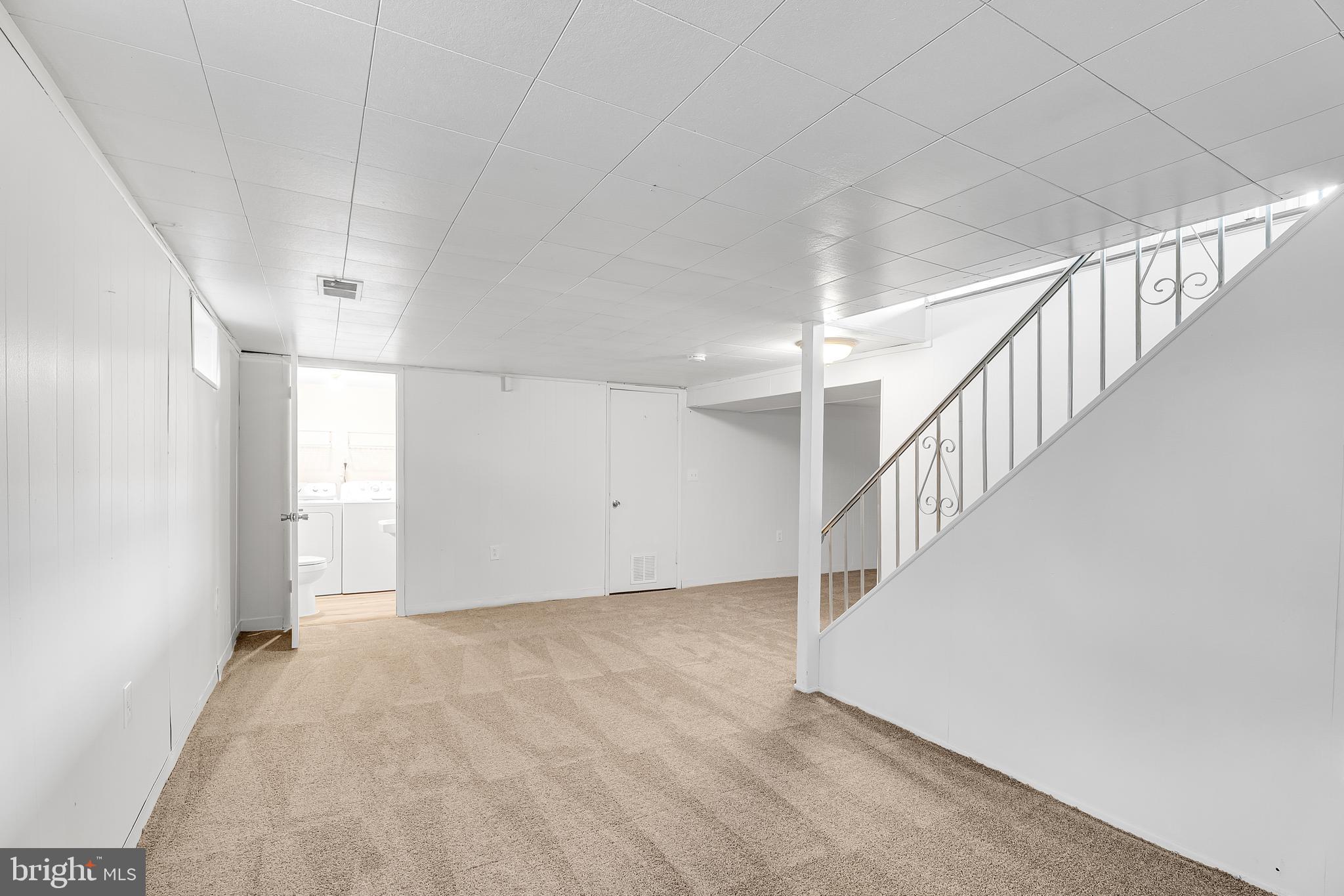 264 Old Line Avenue Laurel, MD 20724 - Photo 23 of 31 a view of room with stairs and a window