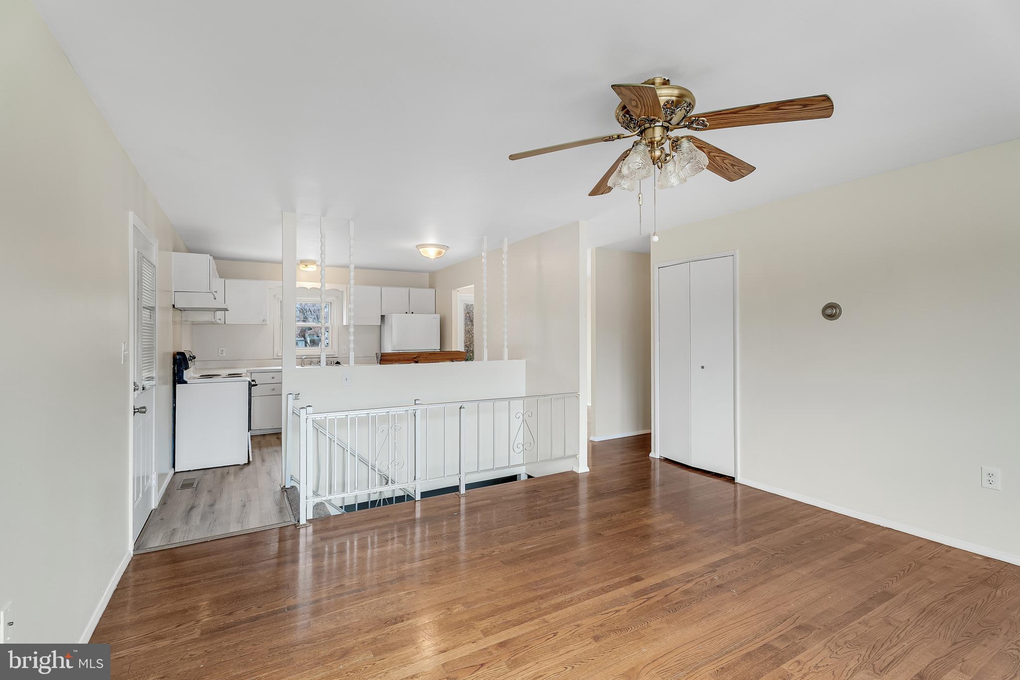 264 Old Line Avenue Laurel, MD 20724 - Photo 4 of 31 a view of living room with white cabinets and wooden floor