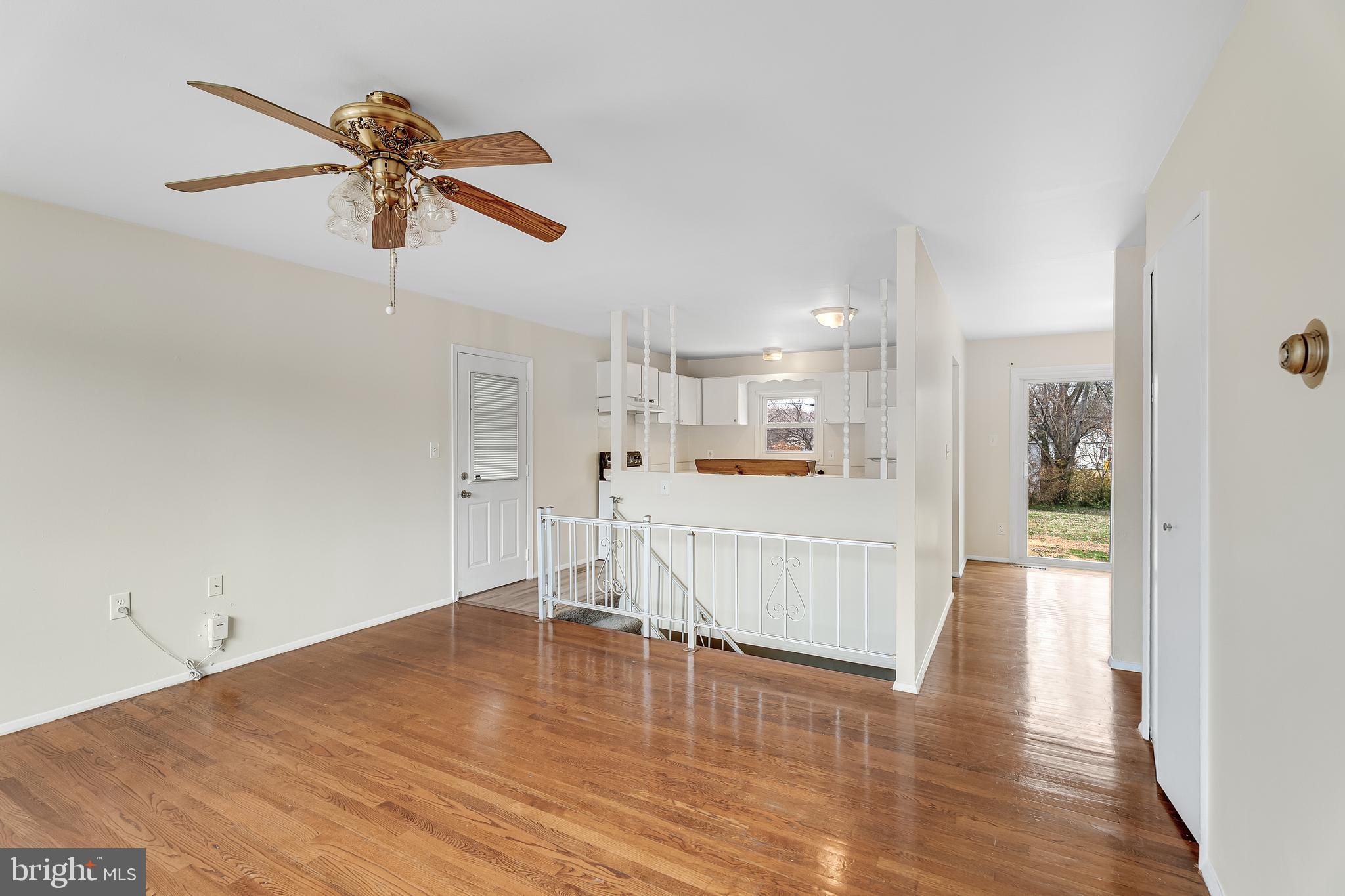 264 Old Line Avenue Laurel, MD 20724 - Photo 6 of 31 a view of a living room and kitchen with wooden floor