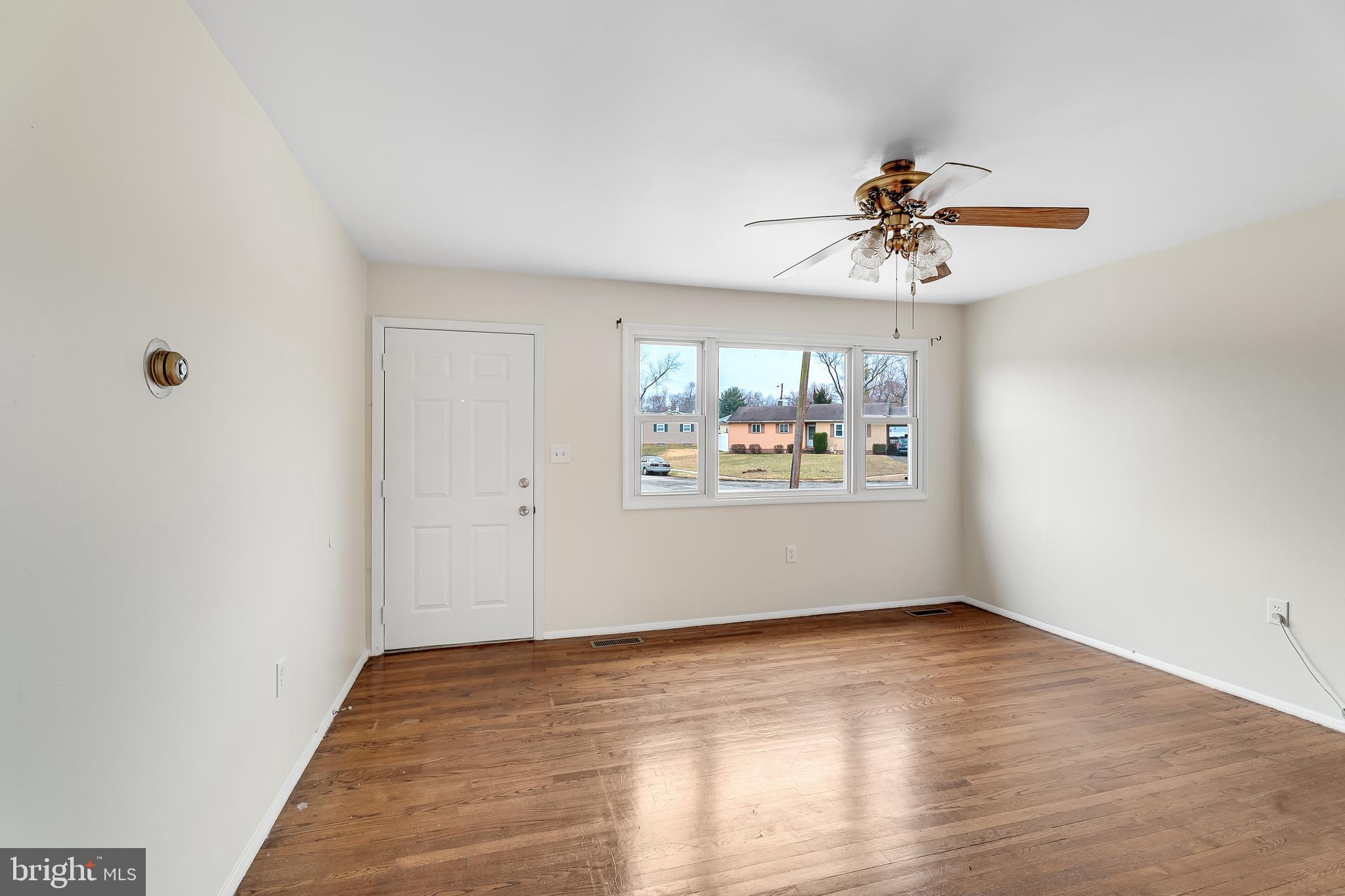 264 Old Line Avenue Laurel, MD 20724 - Photo 7 of 31 a view of a big room with wooden floor and chandelier fan