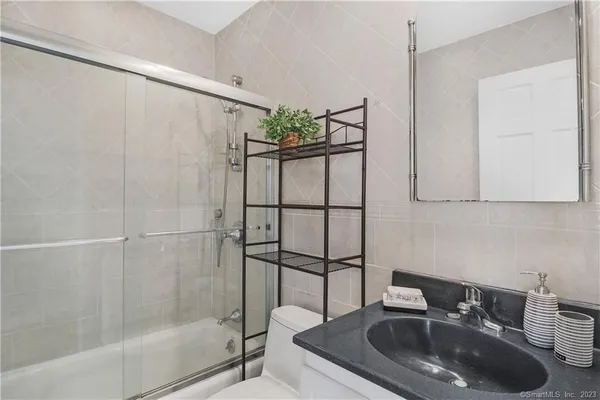 a bathroom with a sink and a shower