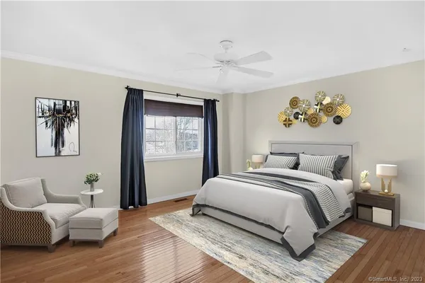 a bedroom with a large bed and a couch