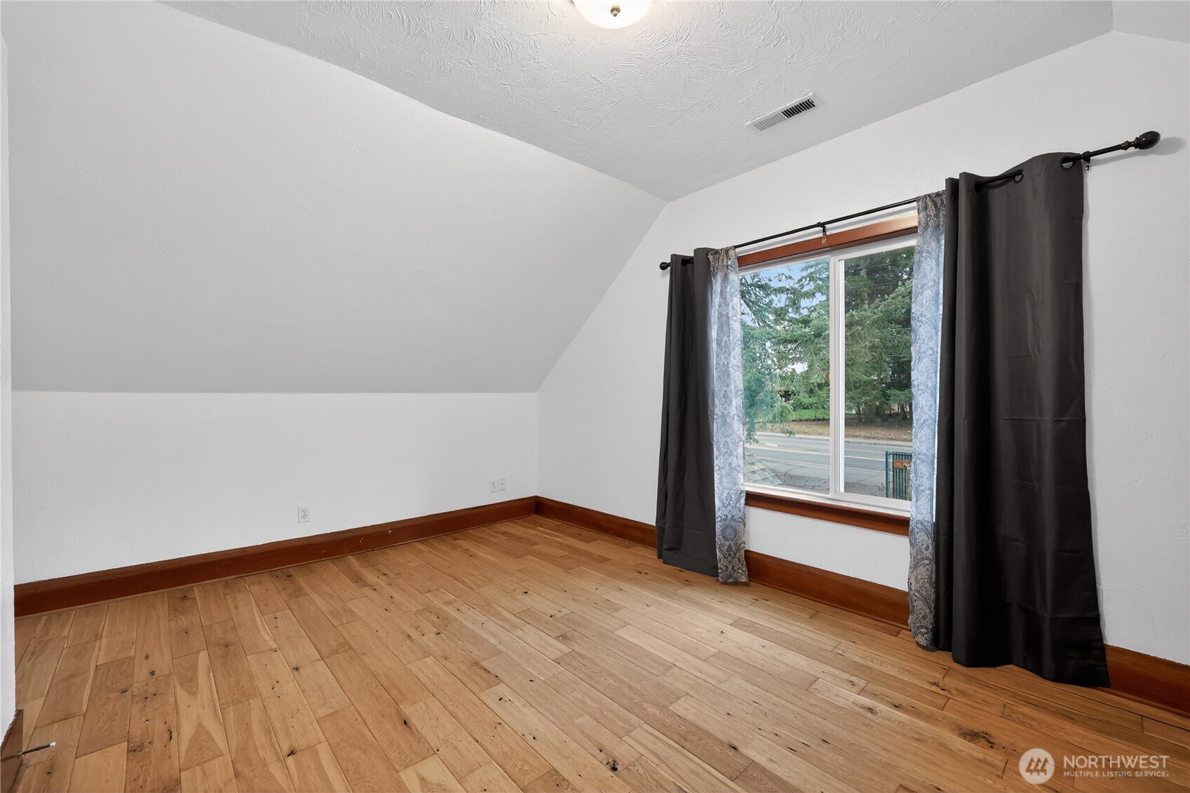 1533 Northcliff Road Shelton, WA 98584 - Photo 32 of 37 a view of an empty room with wooden floor and a window