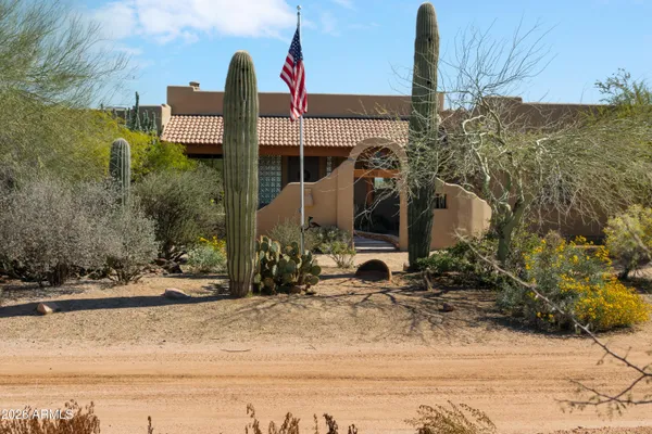 a view of a backyard of the house